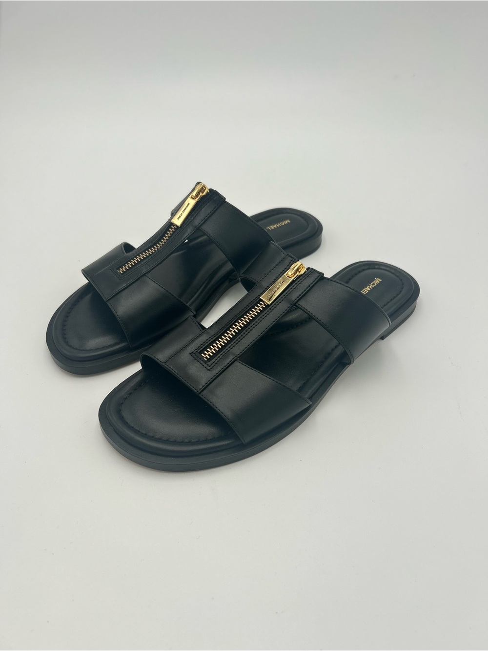 MICHAEL Michael Kors Black Leather Berkley Slip On Flat Sandals w/ Gold Zip
